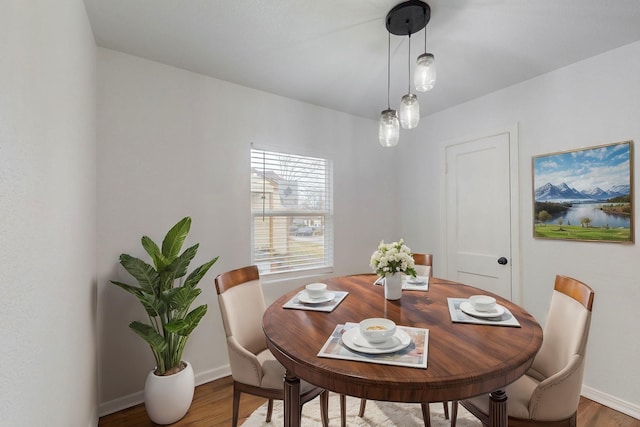 dining area featuring wood-type flooring