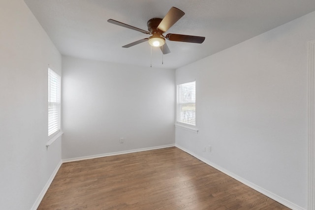 empty room featuring hardwood / wood-style flooring and ceiling fan