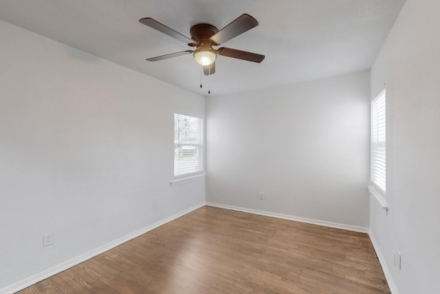 unfurnished room with ceiling fan, plenty of natural light, and light hardwood / wood-style floors