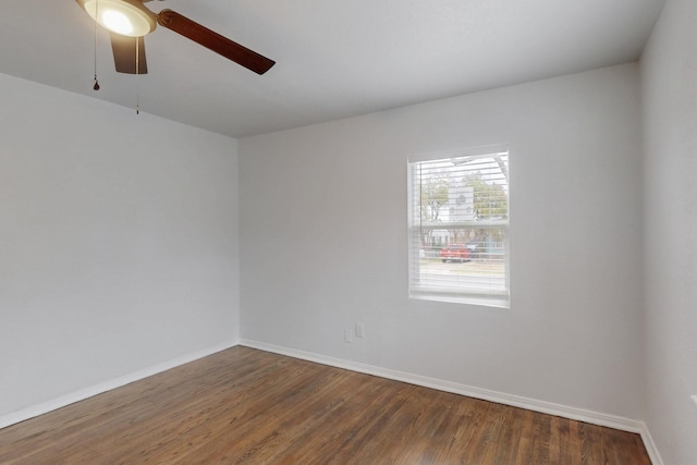 spare room with hardwood / wood-style flooring and ceiling fan