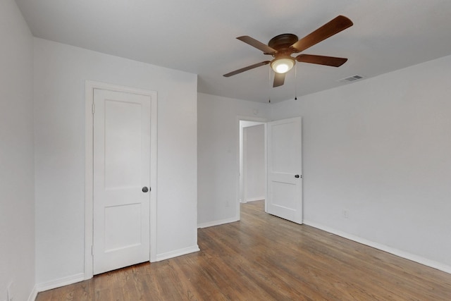 unfurnished bedroom with hardwood / wood-style flooring and ceiling fan