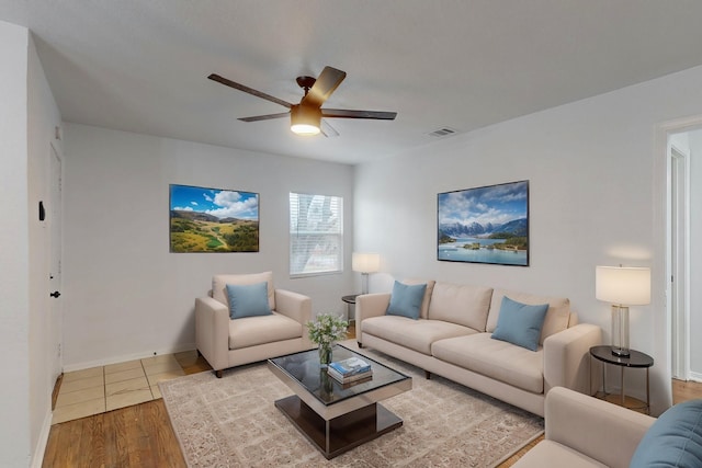 living room with hardwood / wood-style flooring and ceiling fan