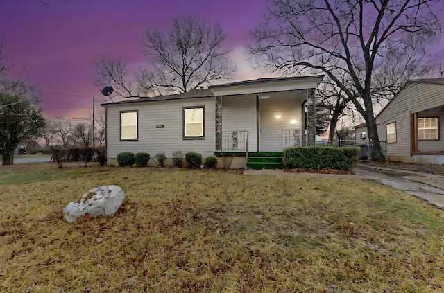 view of front of home with a lawn