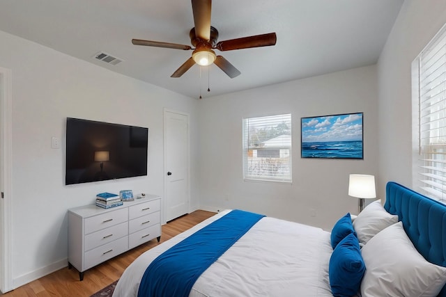 bedroom featuring ceiling fan and light hardwood / wood-style floors