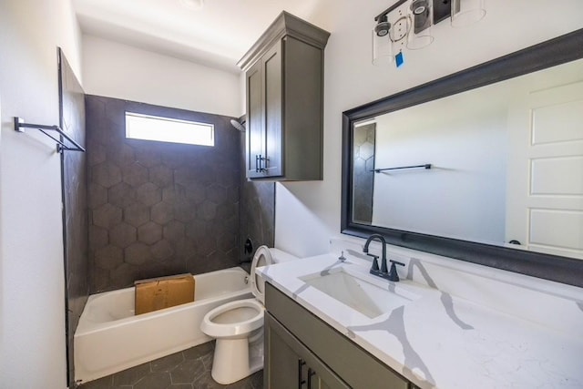 full bathroom with tile patterned flooring, tiled shower / bath combo, toilet, and vanity