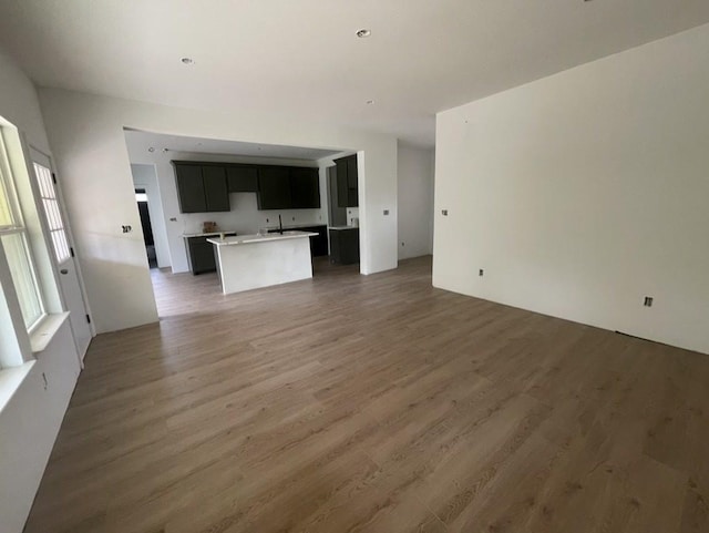 unfurnished living room with dark hardwood / wood-style floors