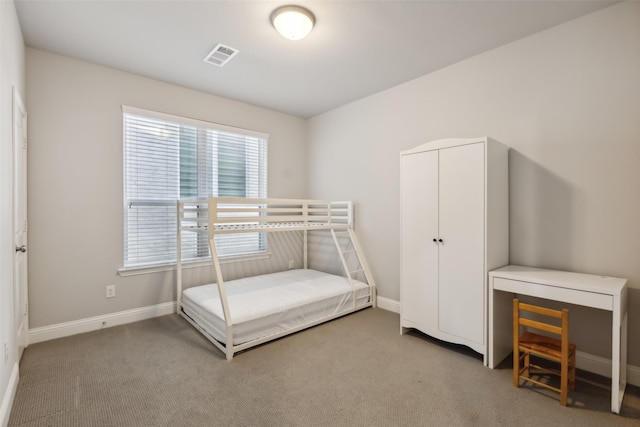 bedroom with light carpet