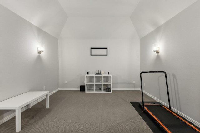 workout area with carpet floors and vaulted ceiling