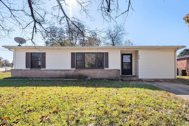 ranch-style house featuring central AC unit and a front lawn