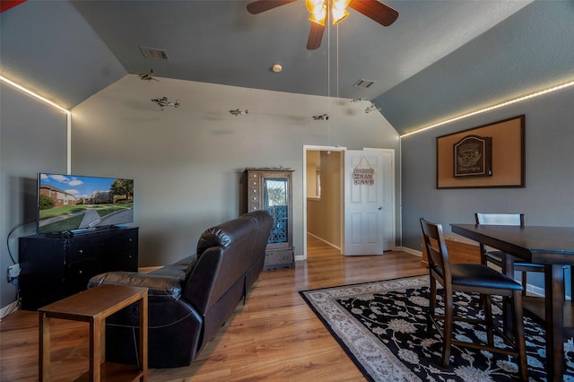 interior space featuring ceiling fan, light wood-type flooring, and vaulted ceiling