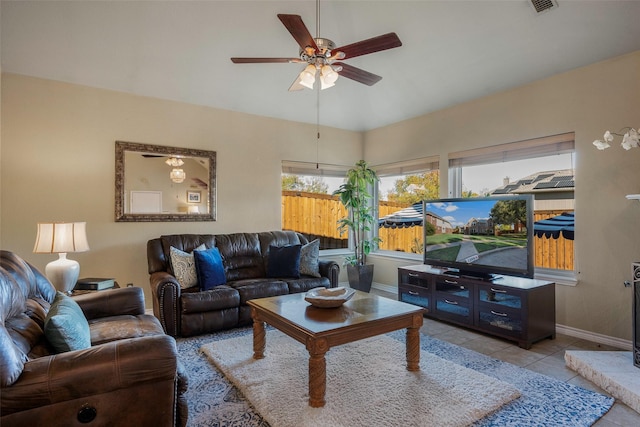 tiled living room with ceiling fan