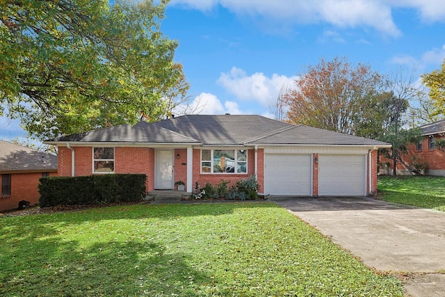 ranch-style house featuring a front lawn and a garage