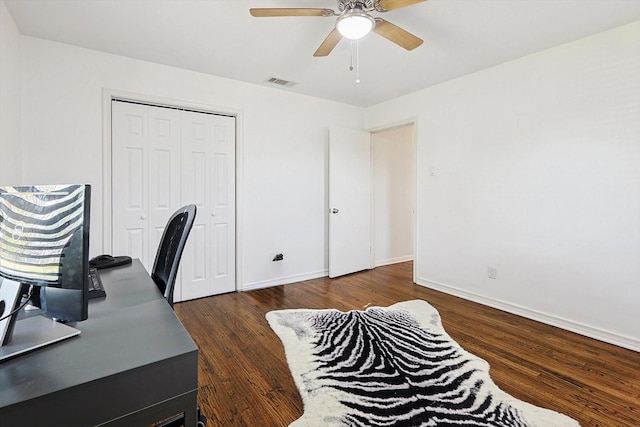 office space with ceiling fan and dark wood-type flooring