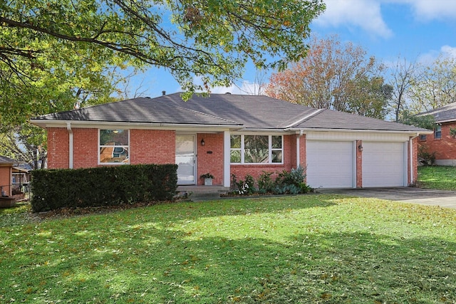 ranch-style home featuring a garage and a front yard