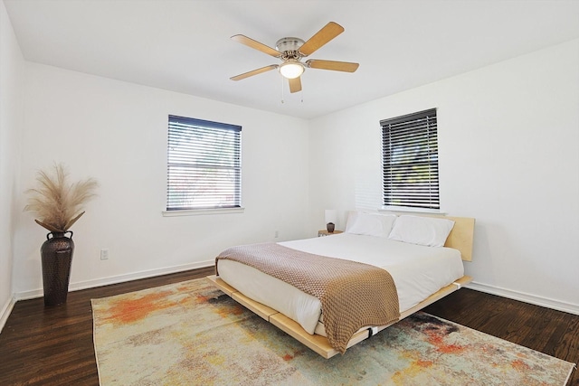 bedroom featuring ceiling fan and dark hardwood / wood-style floors