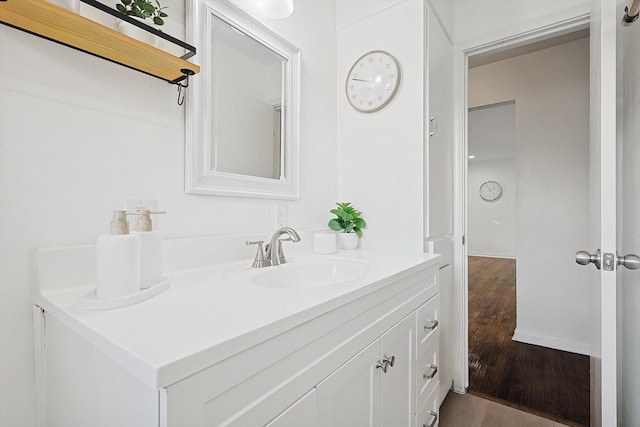 bathroom featuring hardwood / wood-style floors and vanity