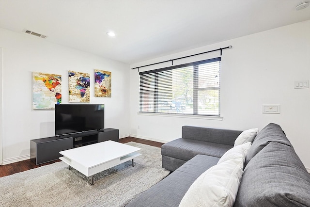 living room featuring dark hardwood / wood-style floors