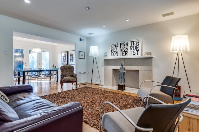 5919 Bordeaux Ave, Dallas, TX 75209 - living room with a fireplace, wood finished floors, visible vents, and recessed lighting