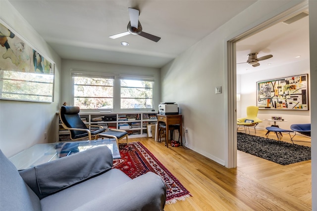 interior space with hardwood / wood-style floors and ceiling fan