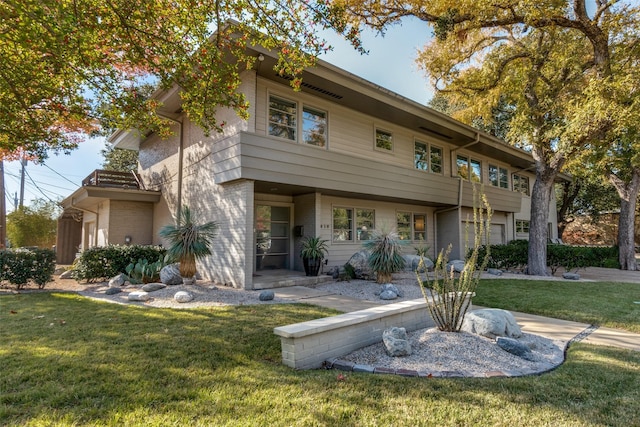5919 Bordeaux Ave, Dallas, TX 75209 - view of front of home featuring an attached garage, a balcony, and a front yard