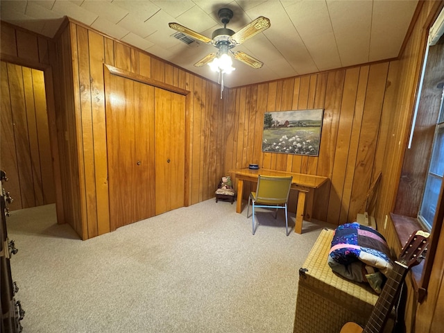904 Uncas St, Logansport, LA 71049 - office area with carpet floors, ceiling fan, and wood walls