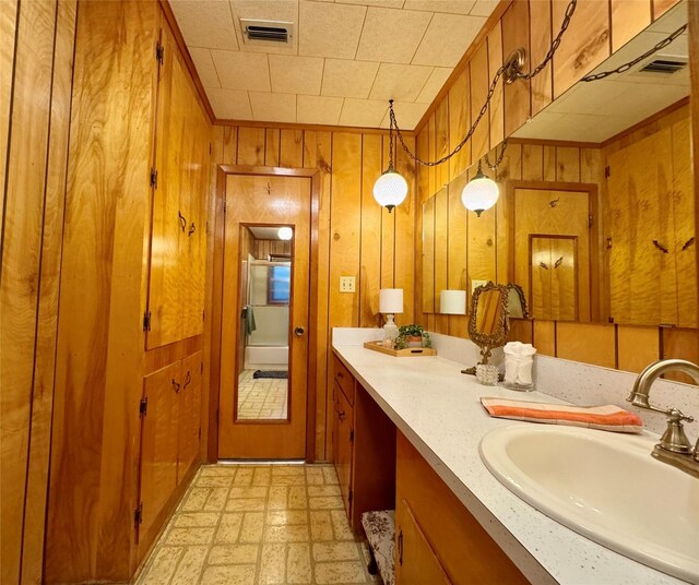 904 Uncas St, Logansport, LA 71049 - bathroom with vanity and wooden walls