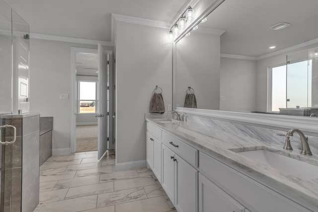 bathroom featuring a shower with door, vanity, and ornamental molding