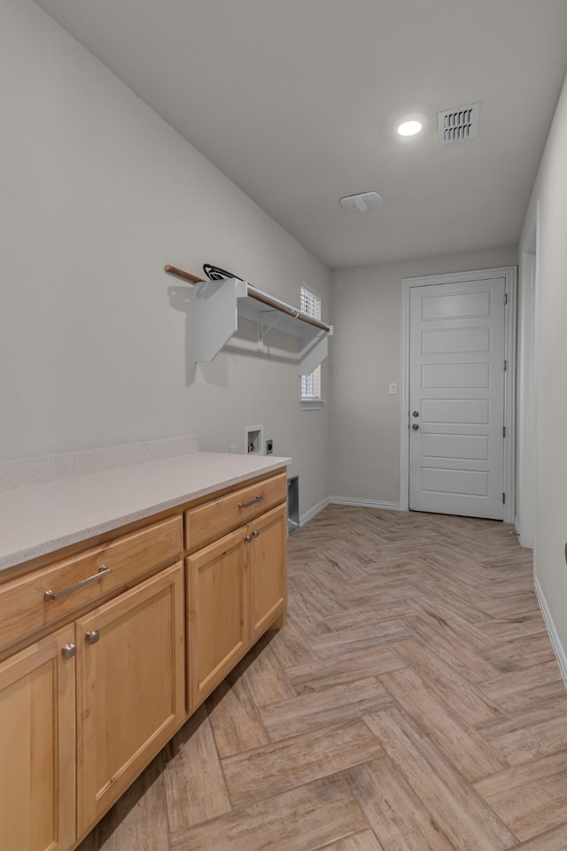 washroom featuring washer hookup, hookup for an electric dryer, and light parquet floors