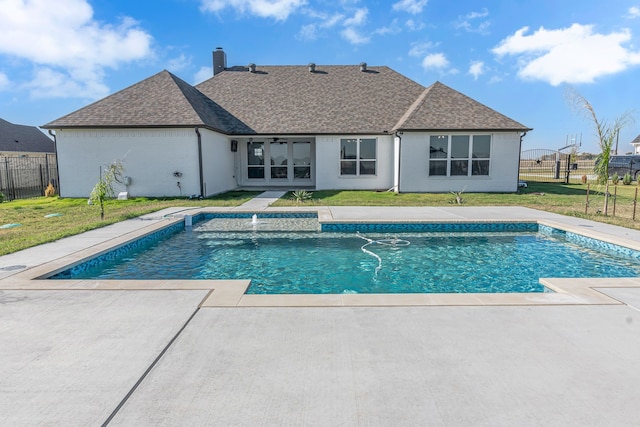 view of pool with a lawn