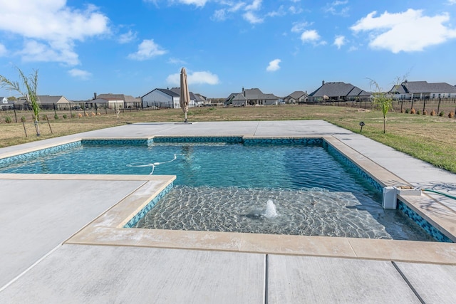 view of swimming pool with a lawn