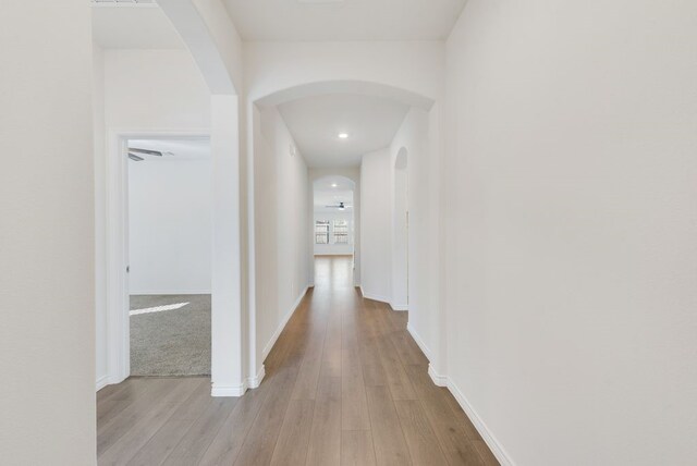 hall with light wood-type flooring