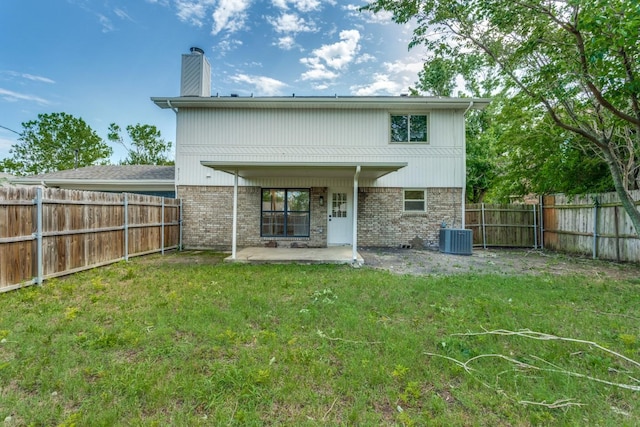 back of property featuring a patio, a yard, and cooling unit