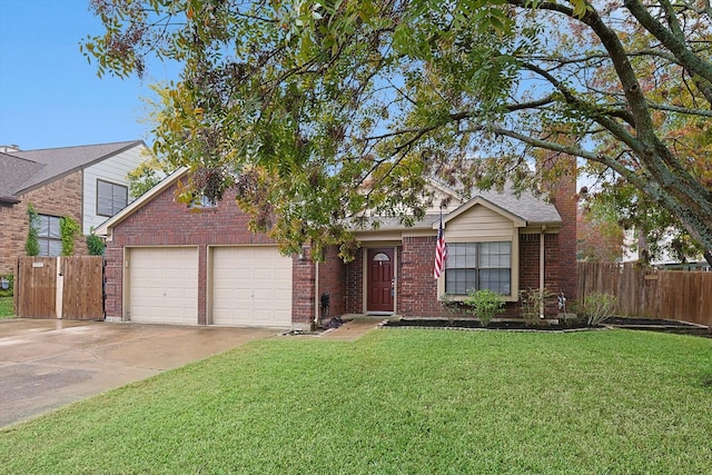 view of front of property featuring a garage and a front yard