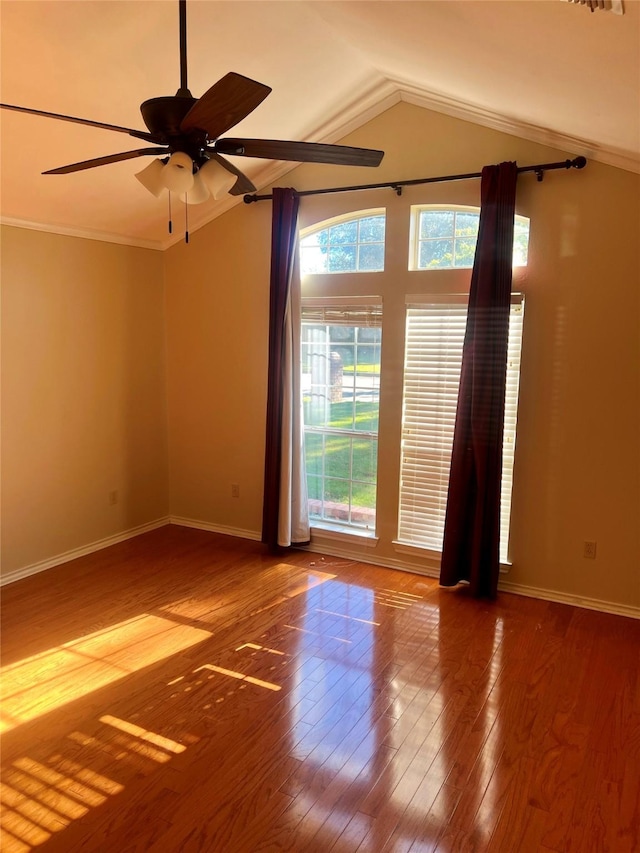 spare room with crown molding, vaulted ceiling, hardwood / wood-style floors, and ceiling fan