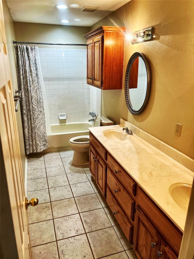 full bathroom with tile patterned floors, vanity, toilet, and shower / bath combo