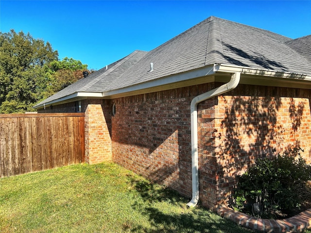 view of property exterior with a yard