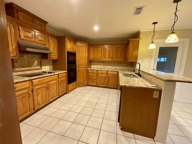 kitchen with light tile patterned flooring, pendant lighting, kitchen peninsula, sink, and black appliances