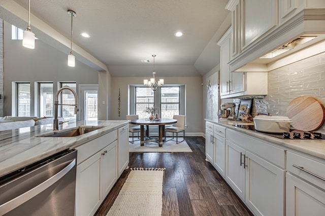 kitchen featuring a healthy amount of sunlight, dishwasher, dark wood-type flooring, and sink