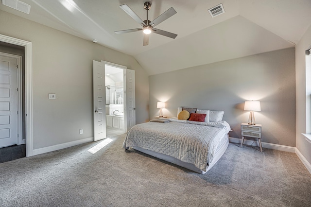 bedroom featuring connected bathroom, carpet floors, vaulted ceiling, and ceiling fan