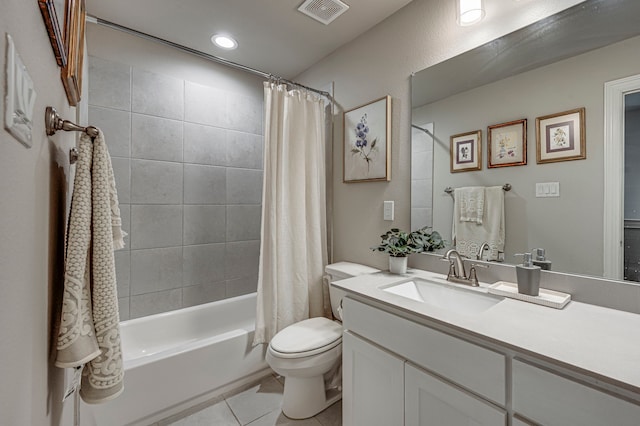 full bathroom with tile patterned flooring, vanity, shower / tub combo, and toilet