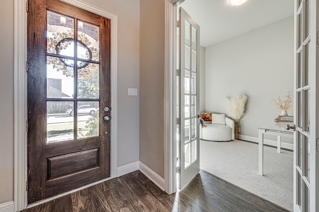 foyer entrance with dark hardwood / wood-style flooring and french doors