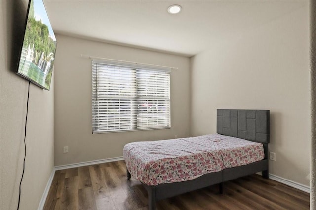 bedroom featuring dark hardwood / wood-style flooring