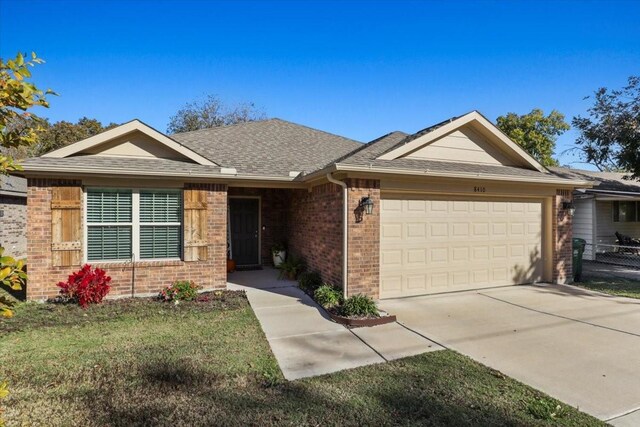 ranch-style house featuring a garage