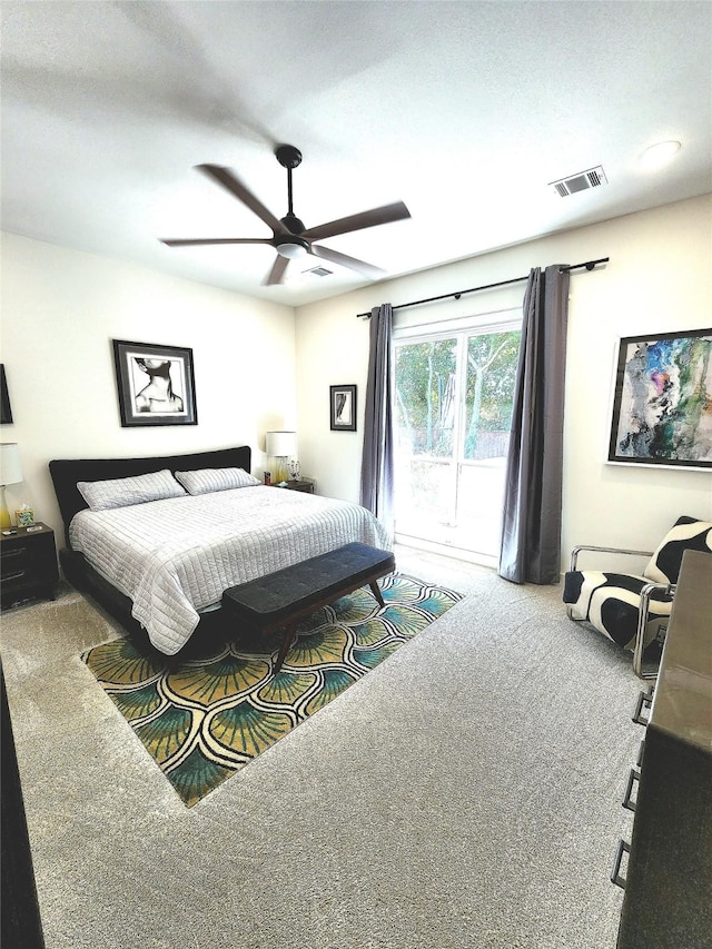 bedroom featuring carpet floors, access to outside, and ceiling fan