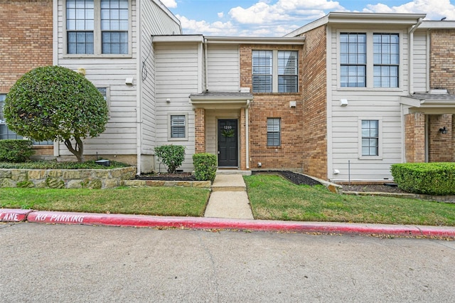 view of property with a front lawn