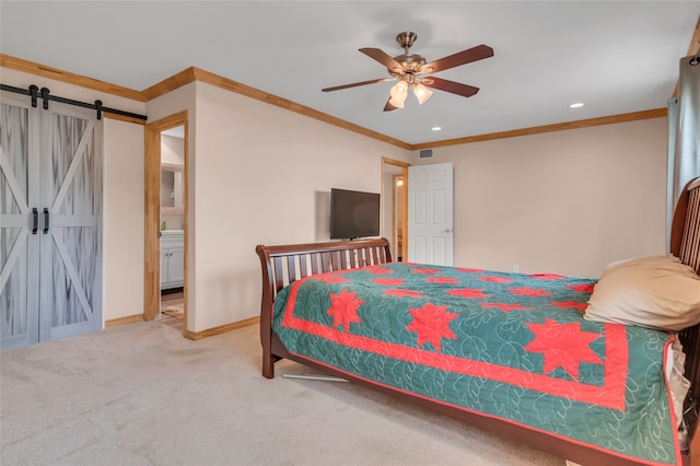 carpeted bedroom with crown molding, a barn door, and ceiling fan