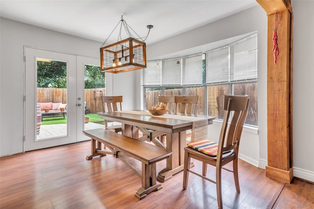 dining space featuring french doors and hardwood / wood-style floors