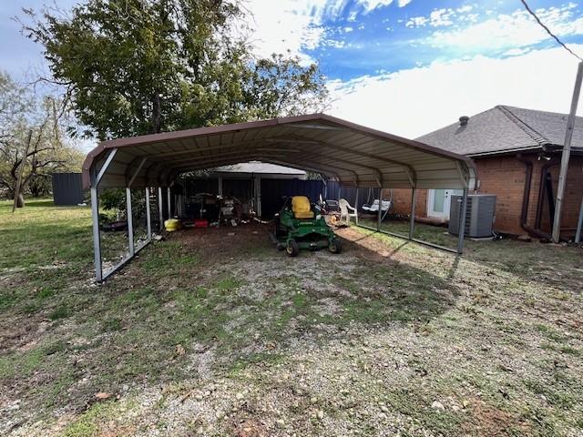 view of vehicle parking featuring a carport