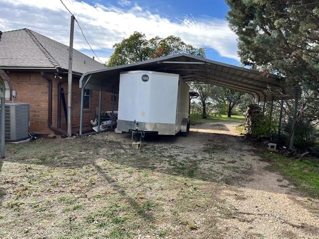 exterior space featuring a carport