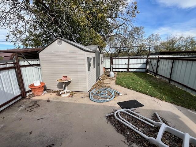 view of patio / terrace with a shed